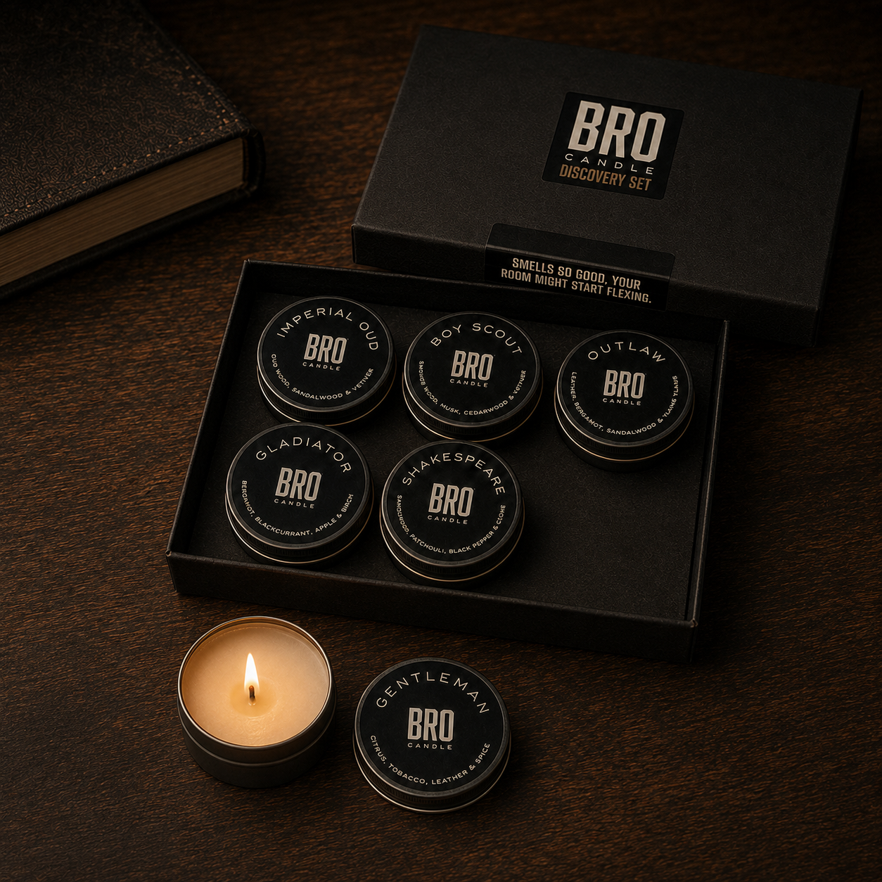 The Bro Candle Discovery Set open on a desk, six mini tins and one lit